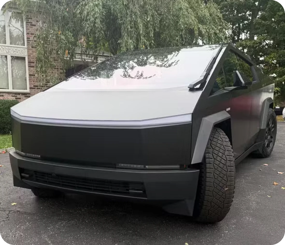 Sleek electric vehicle in driveway